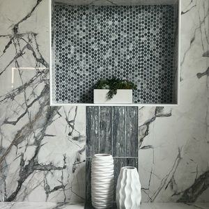 White vases beautifully crafted with ribbed swirls throughout.